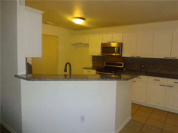 a an empty room with a fireplace