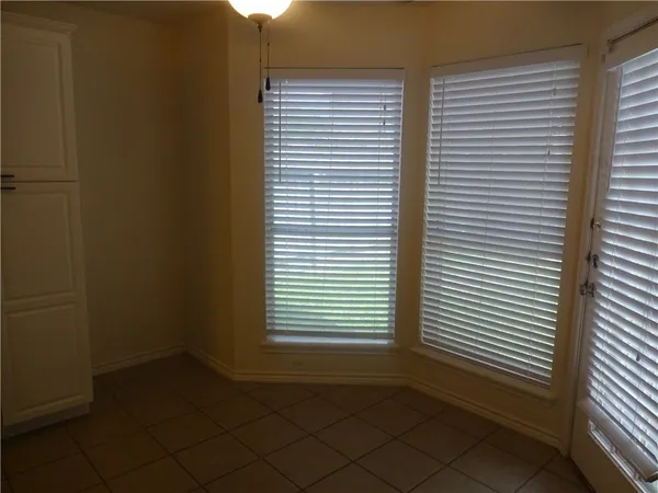 a view of an empty room with stairs