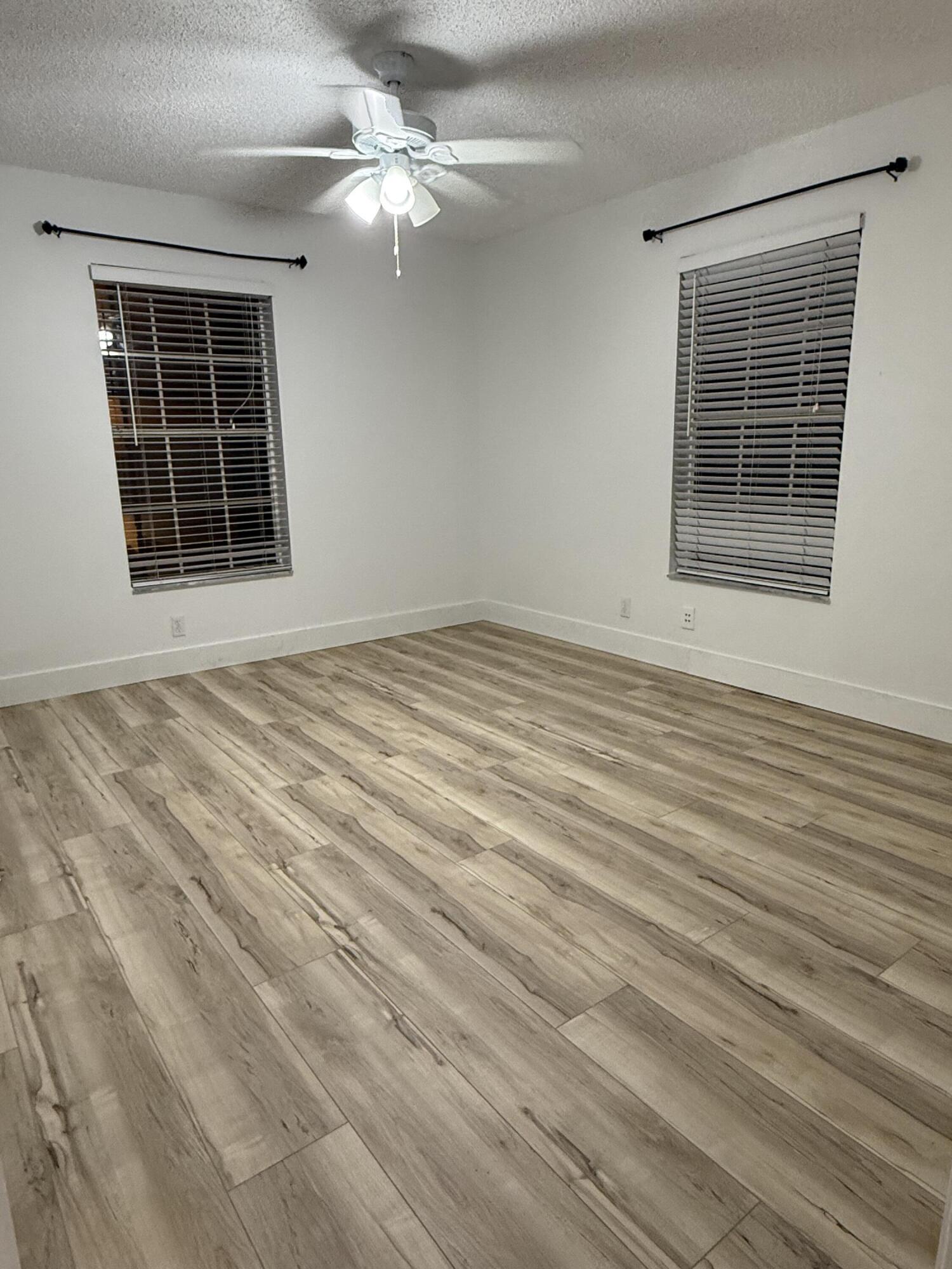 6315 La Costa Drive, Unit E Boca Raton, FL 33433 - Photo 15 of 22 a view of an empty room with a window