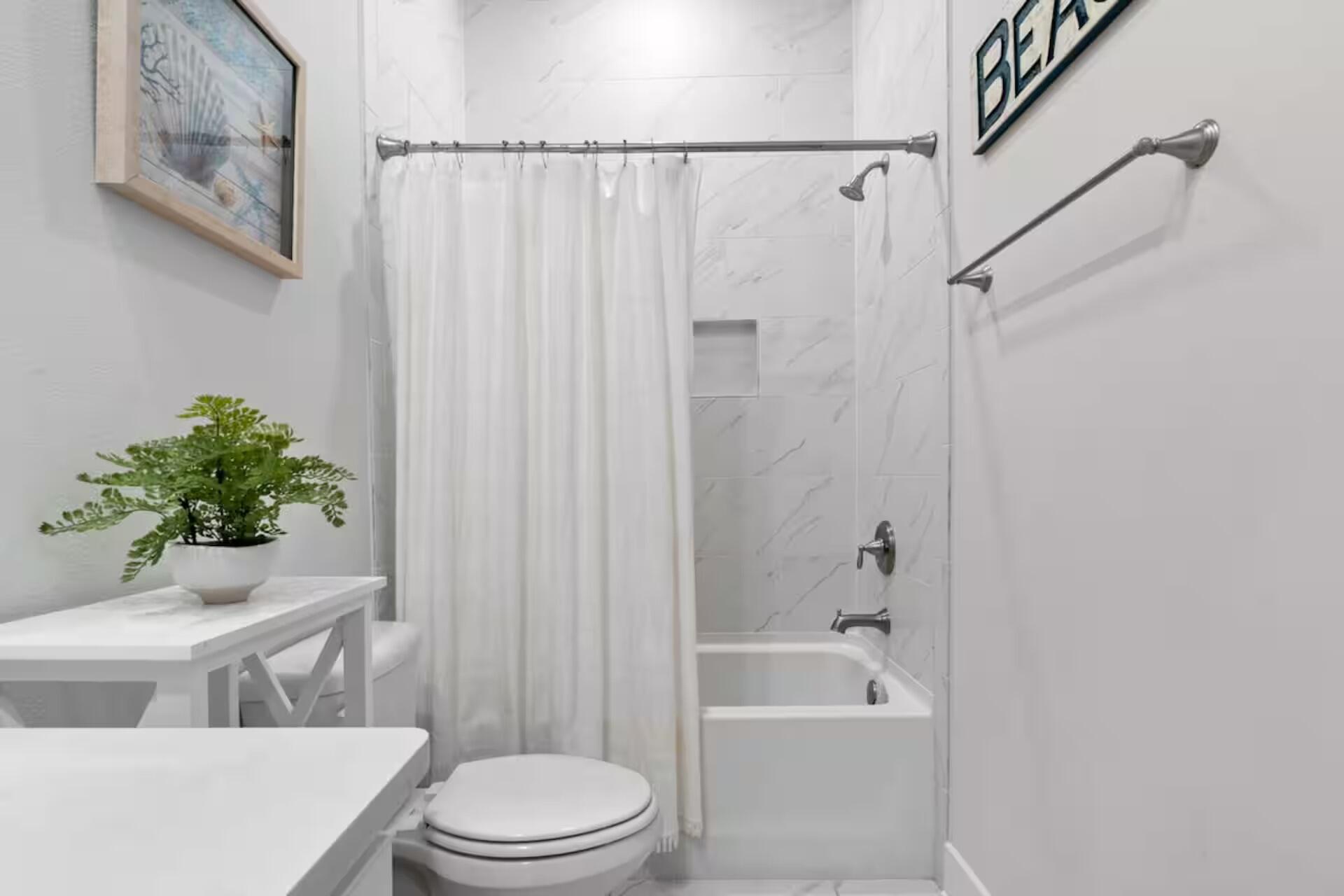 146 East E Pine, Unit B Inlet Beach, FL 32461 - Photo 30 of 47 a bathroom with a toilet a sink and bathtub