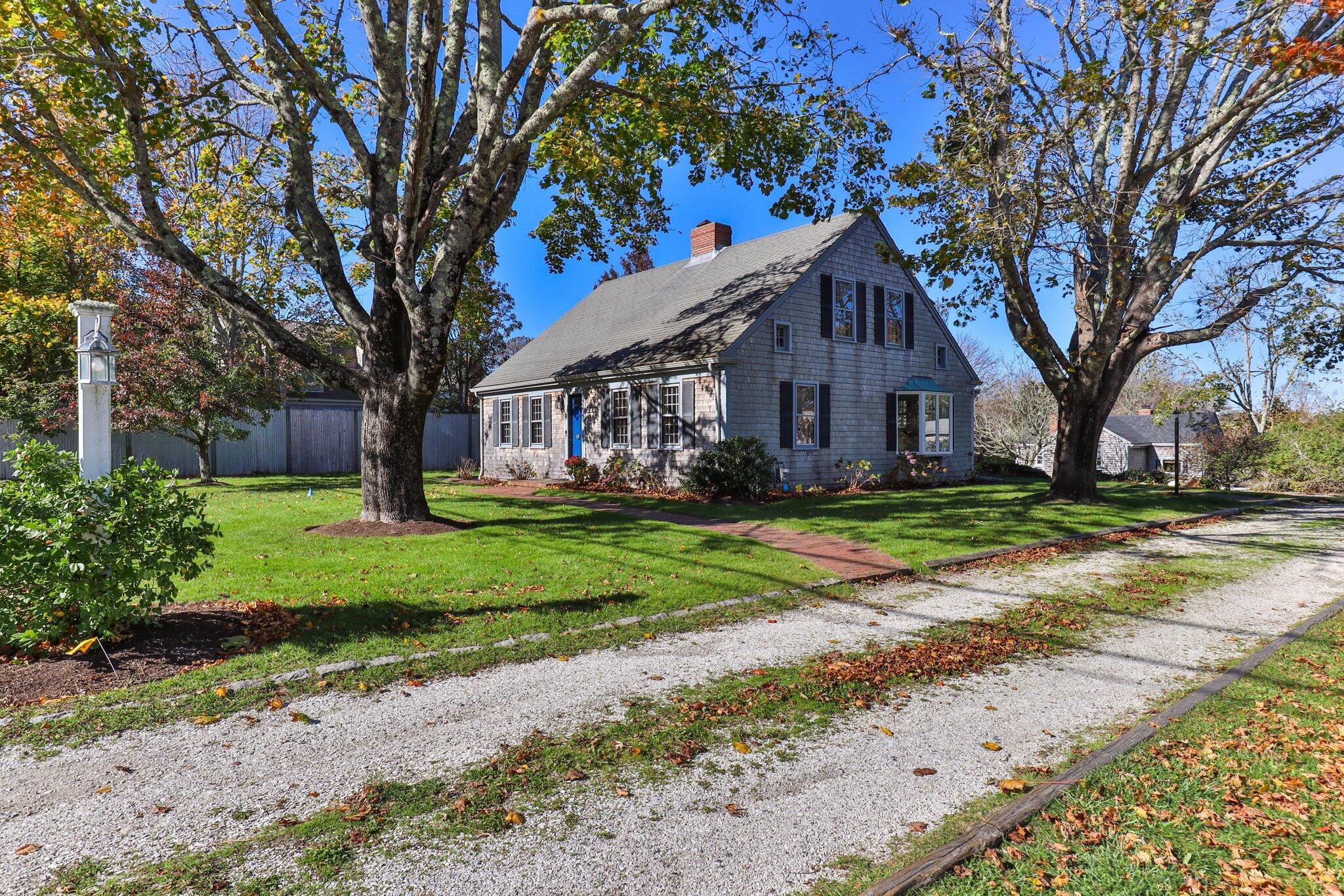 400 Lower County Road Harwich Port, MA 02646 - Photo 1 of 49 a front view of house with yard and green space