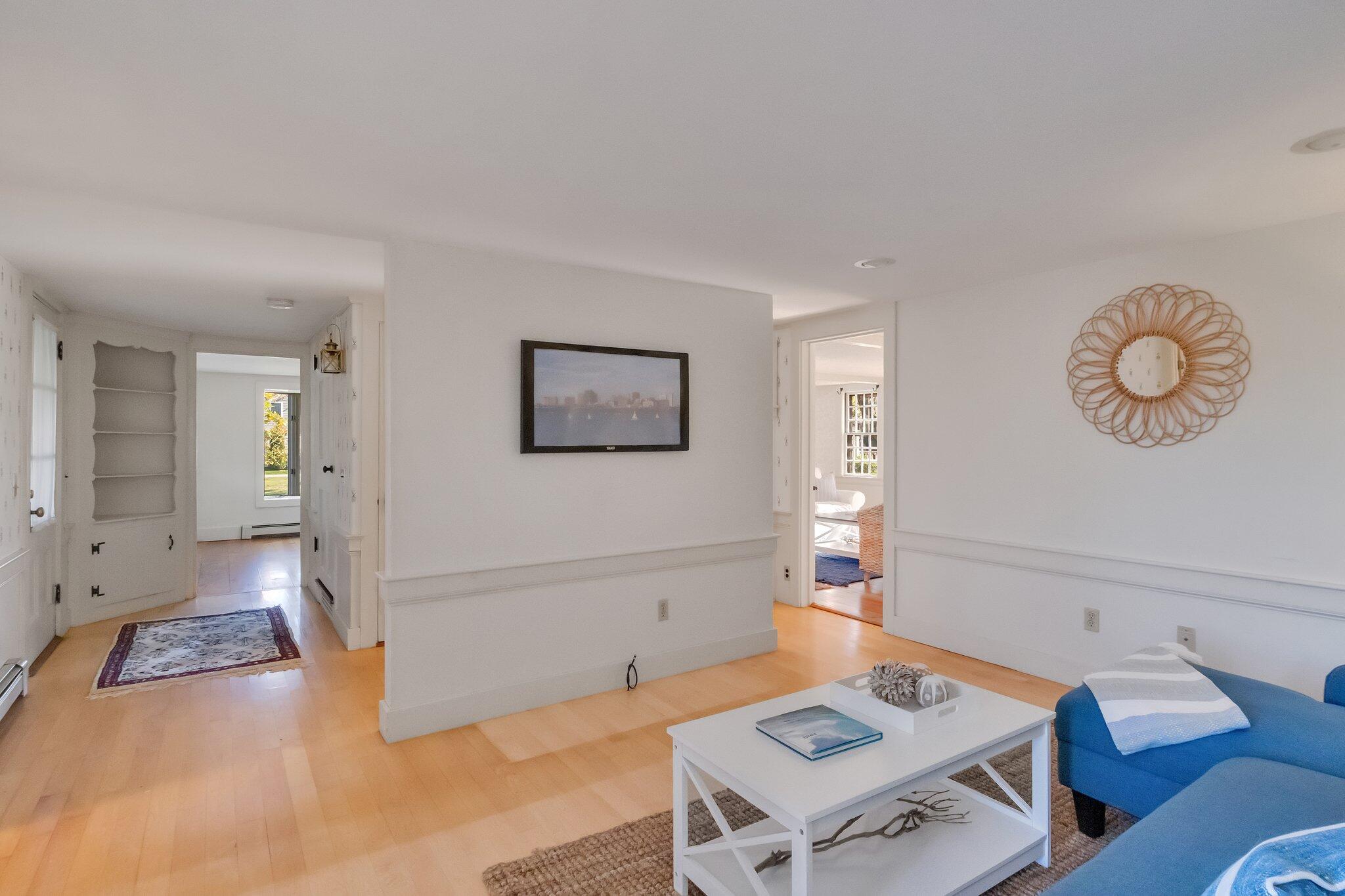 400 Lower County Road Harwich Port, MA 02646 - Photo 26 of 49 a living room with furniture and a table