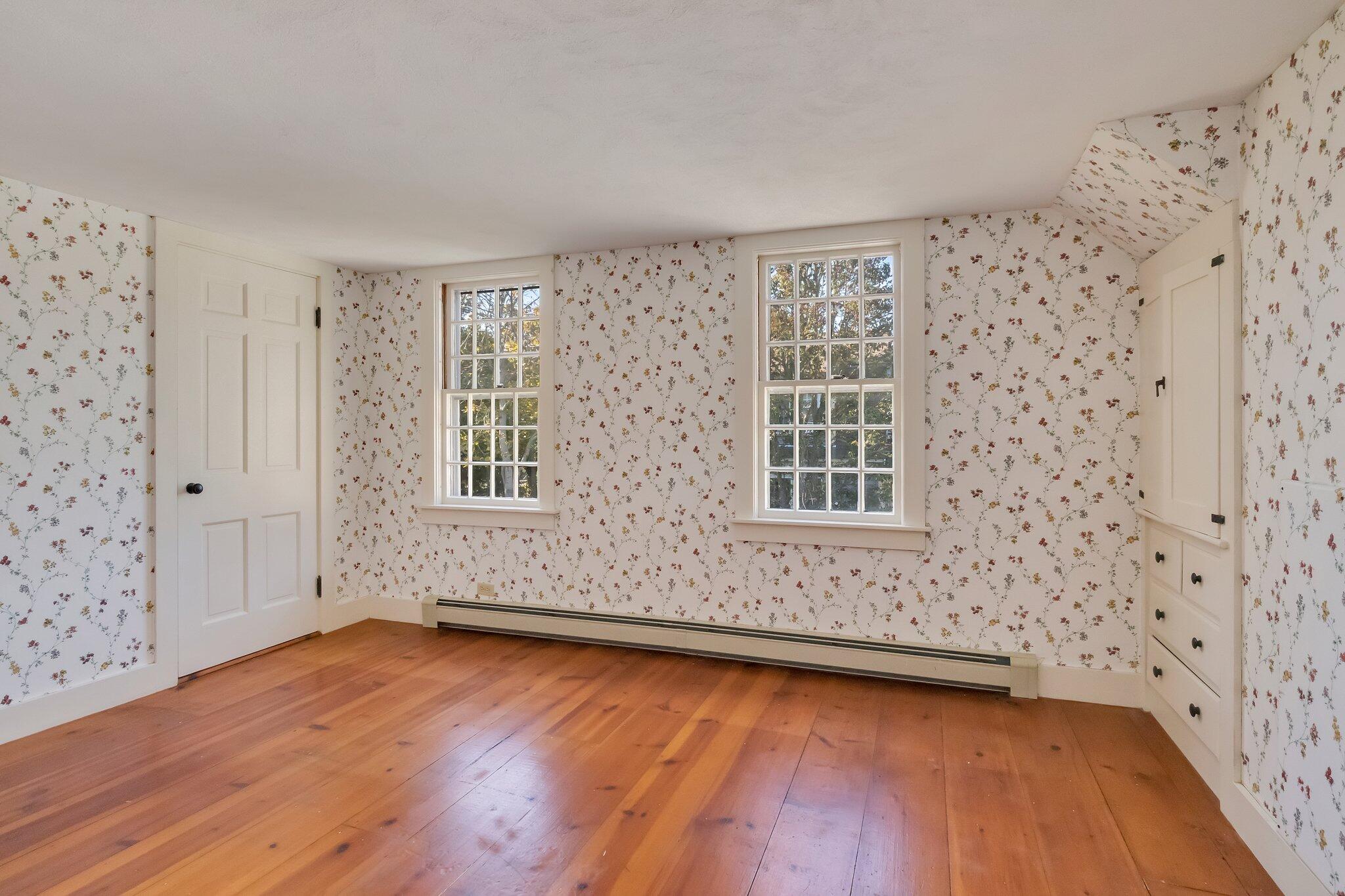 400 Lower County Road Harwich Port, MA 02646 - Photo 28 of 49 a view of an empty room with wooden floor and a window