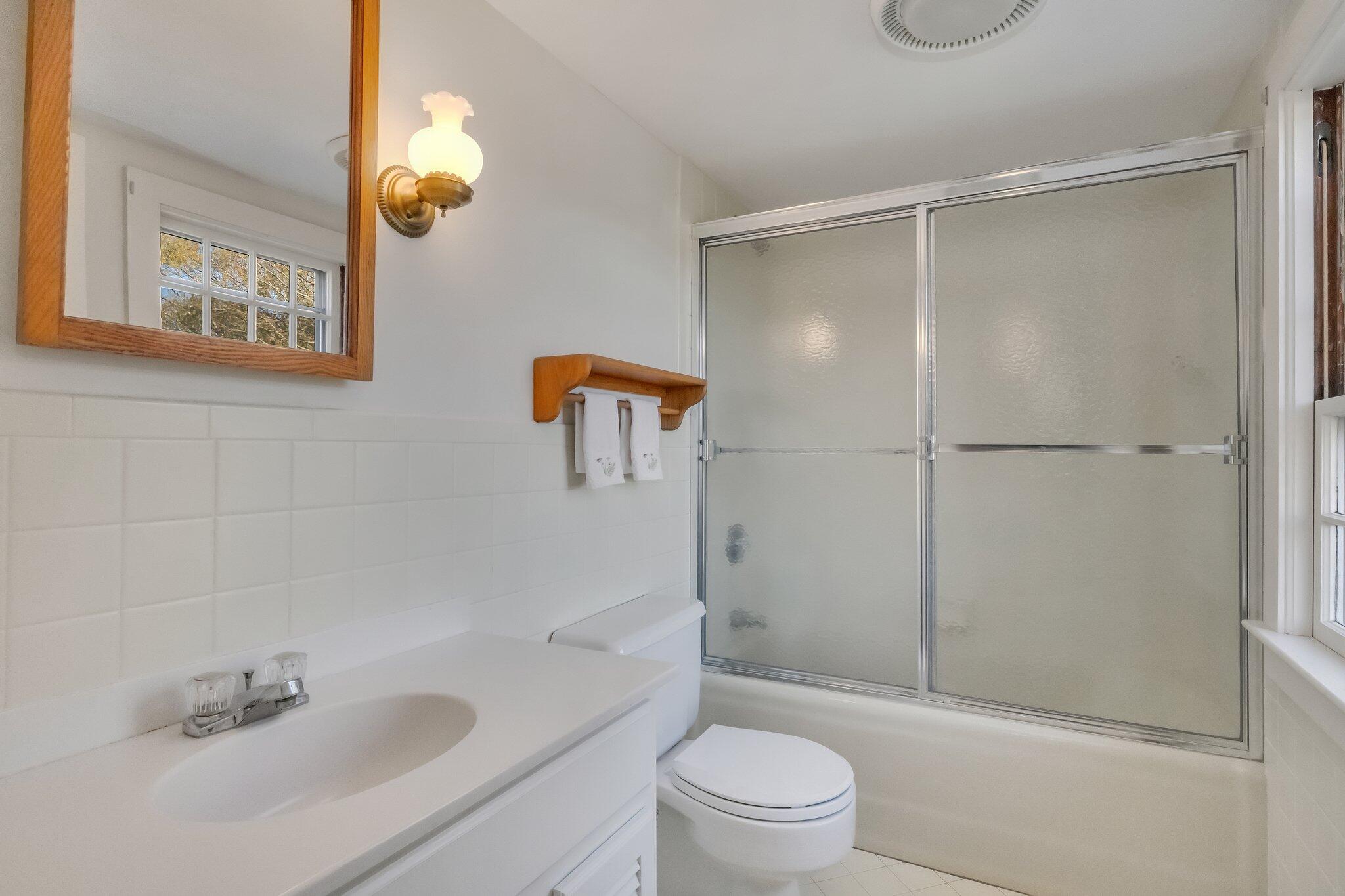 400 Lower County Road Harwich Port, MA 02646 - Photo 30 of 49 a bathroom with a sink a toilet and shower