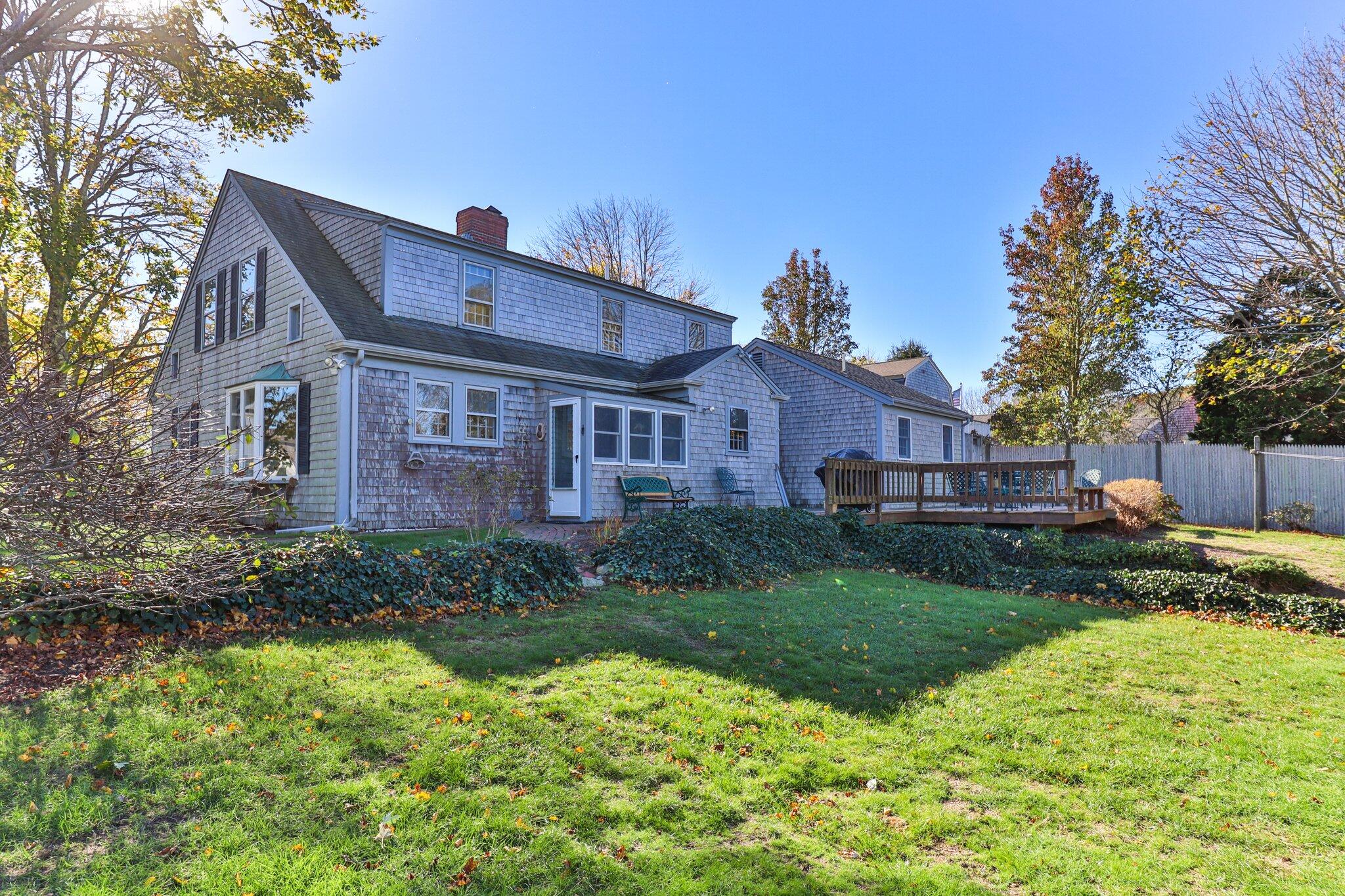 400 Lower County Road Harwich Port, MA 02646 - Photo 42 of 49 a front view of house with yard and green space