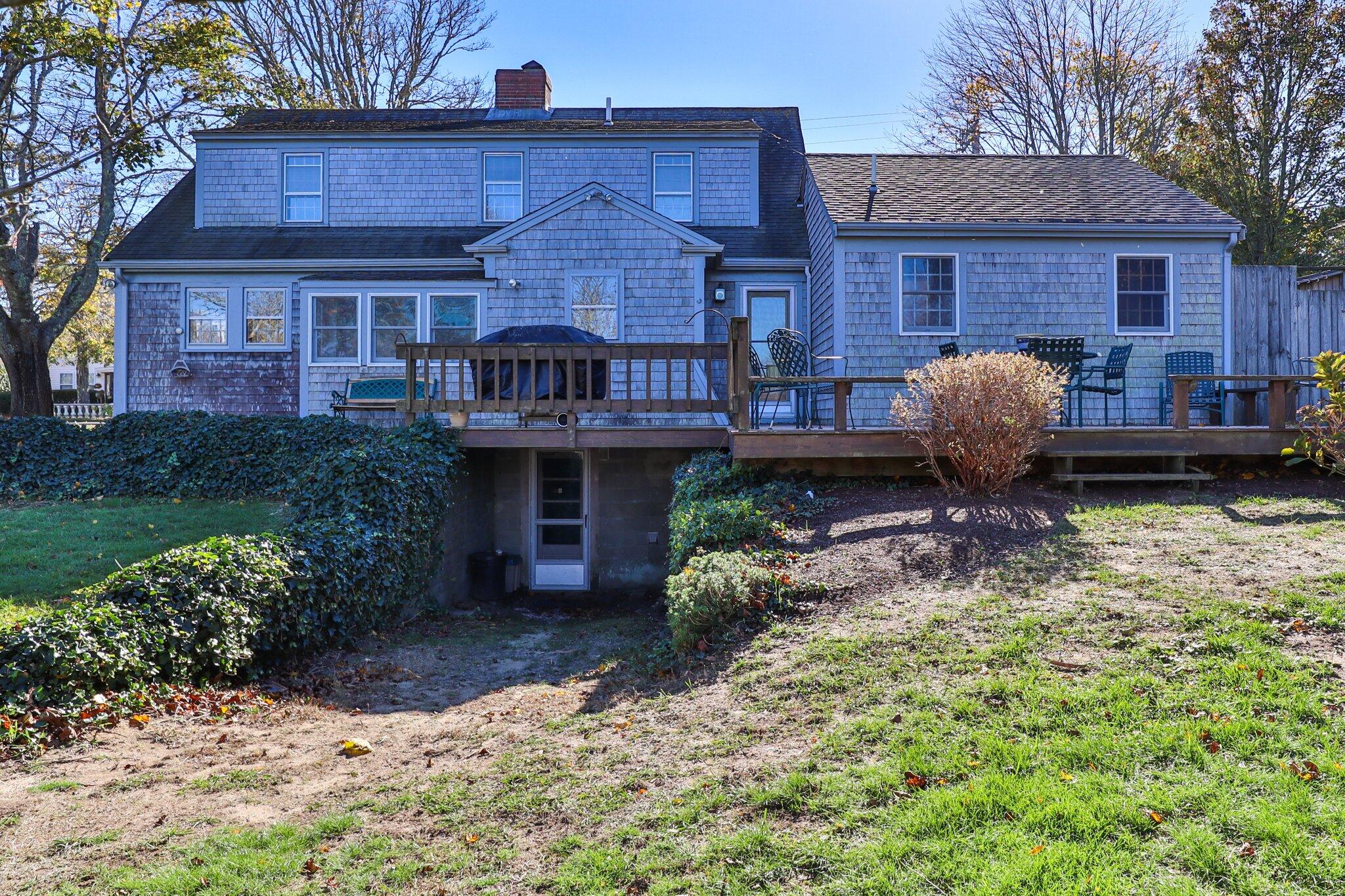 400 Lower County Road Harwich Port, MA 02646 - Photo 43 of 49 a front view of a house with garden and porch