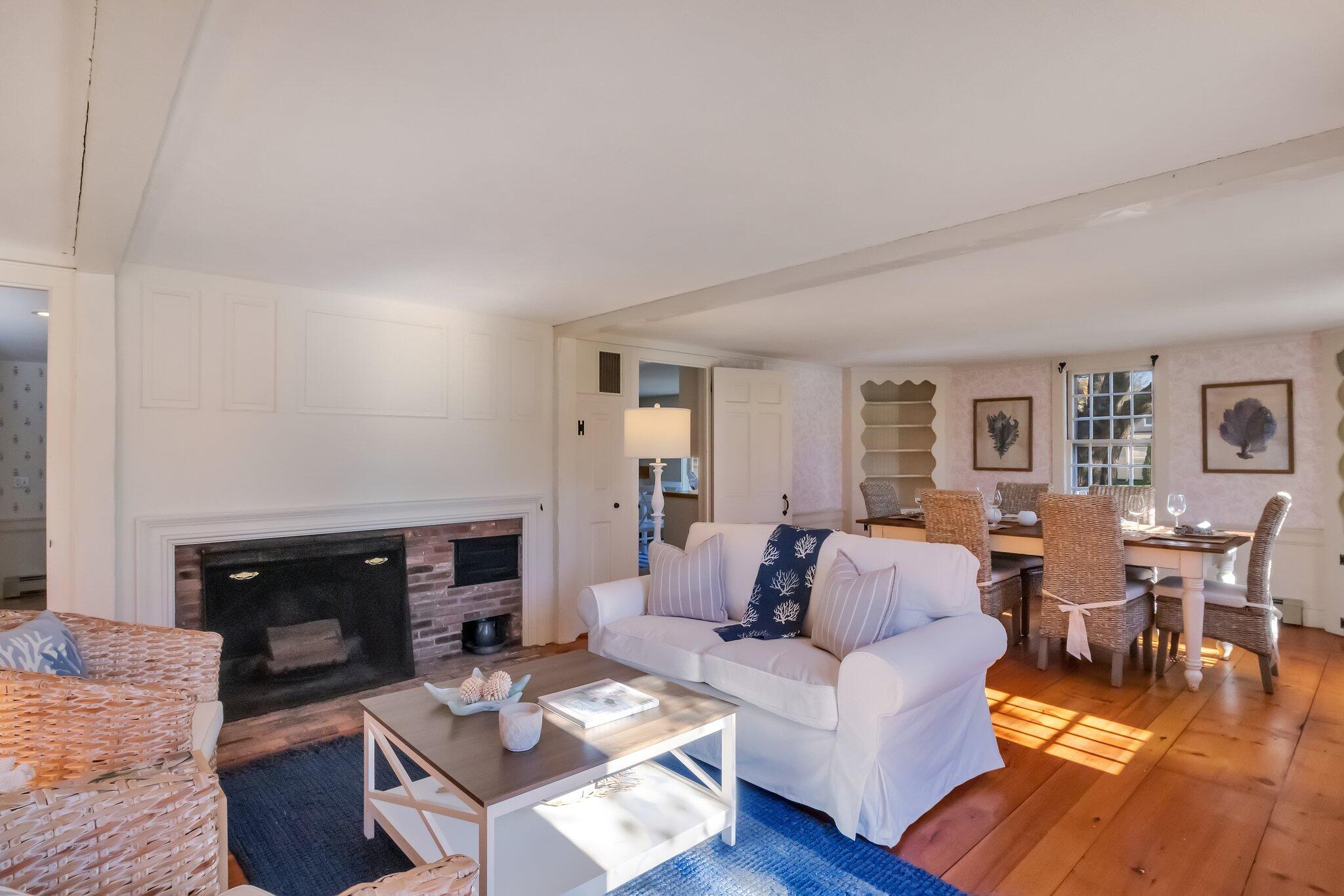 400 Lower County Road Harwich Port, MA 02646 - Photo 7 of 49 a living room with furniture and a fireplace