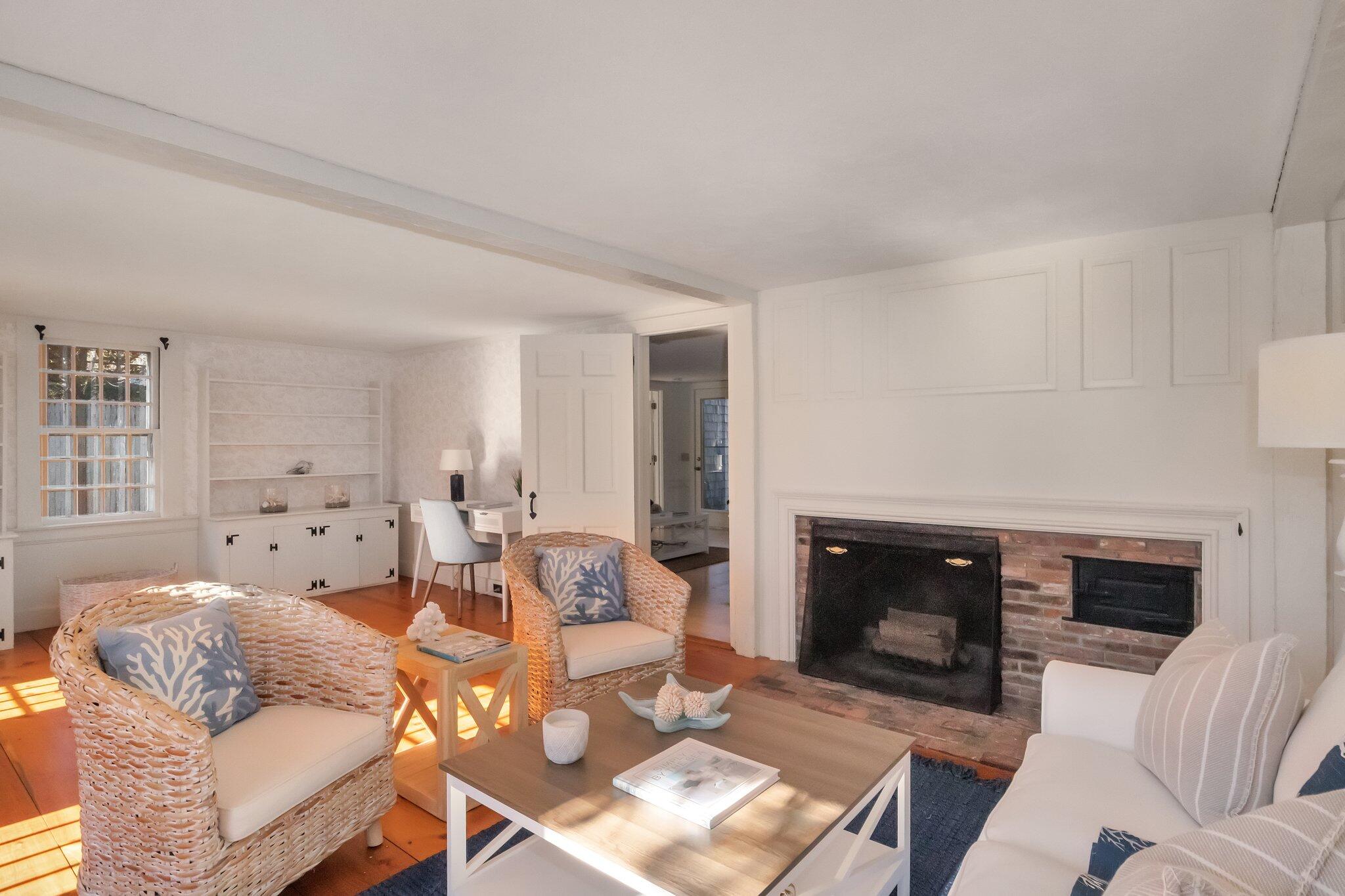400 Lower County Road Harwich Port, MA 02646 - Photo 9 of 49 a living room with furniture a fireplace and a large window