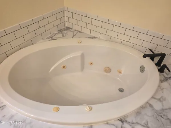 a view of a bathtub in a bathroom