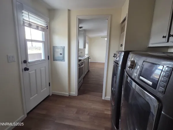 a view of a storage and utility room in wooden floor
