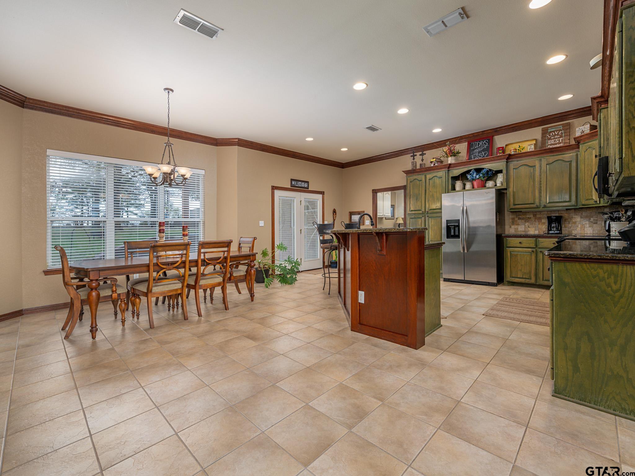 11201 Skyline Drive Brownsboro, TX 75756 - Photo 20 of 39 a kitchen with stainless steel appliances granite countertop a refrigerator and a stove top oven