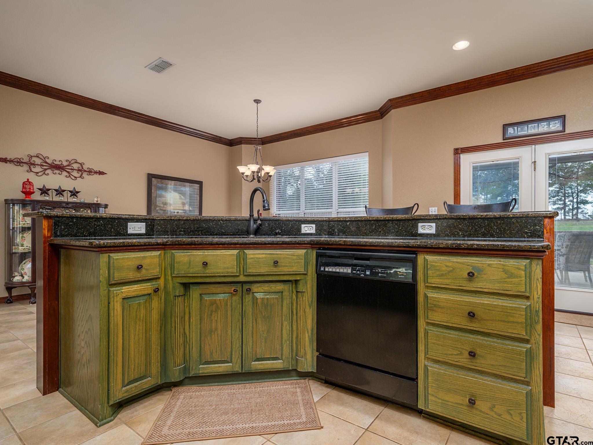 11201 Skyline Drive Brownsboro, TX 75756 - Photo 25 of 39 a kitchen with granite countertop a sink and cabinets