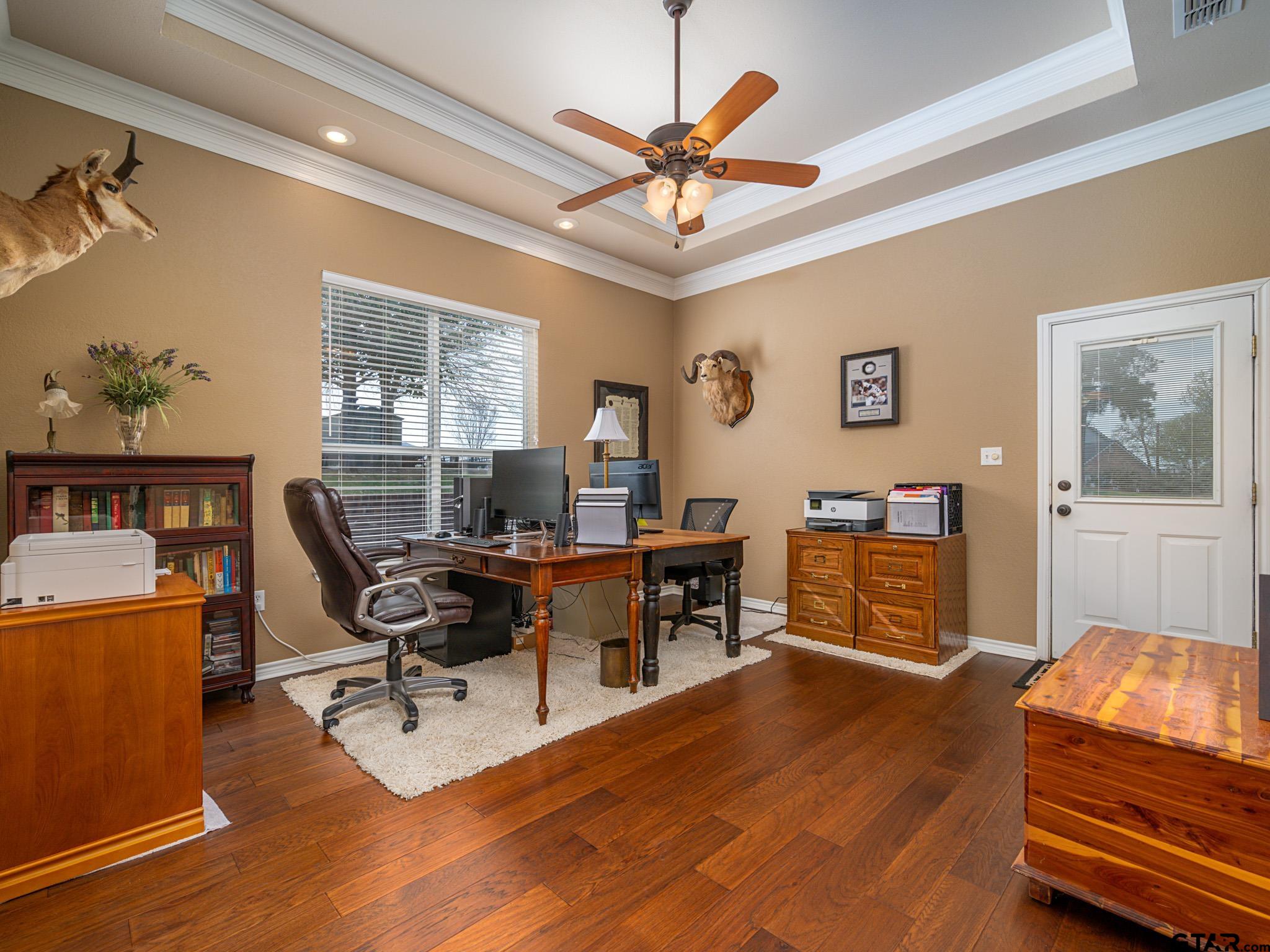 11201 Skyline Drive Brownsboro, TX 75756 - Photo 27 of 39 a workspace with wooden floor and furniture