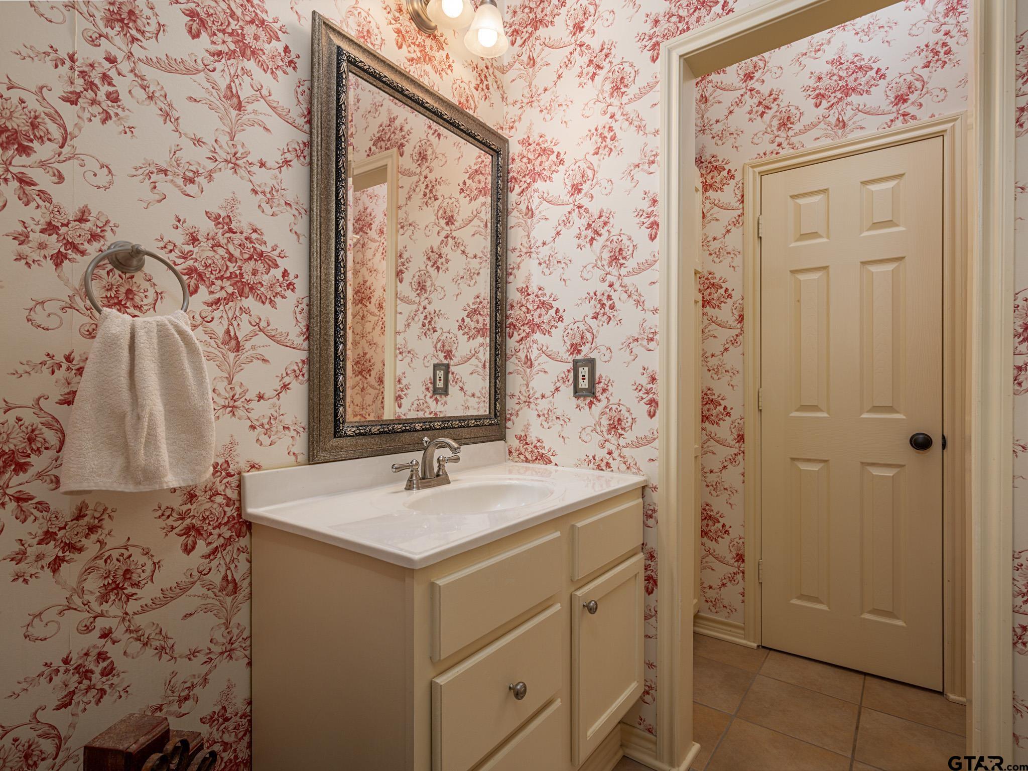 11201 Skyline Drive Brownsboro, TX 75756 - Photo 28 of 39 a bathroom with a sink and a mirror