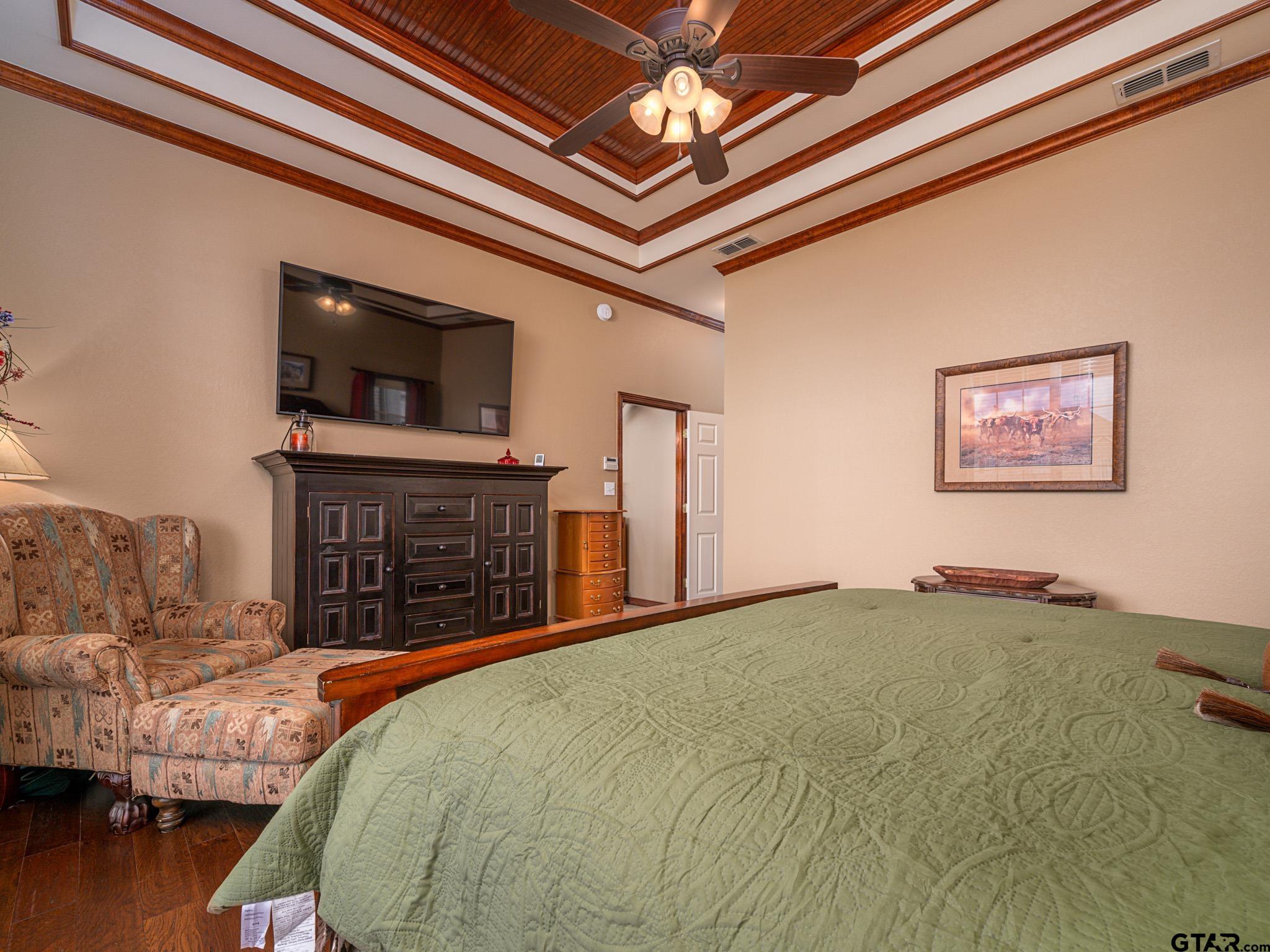11201 Skyline Drive Brownsboro, TX 75756 - Photo 31 of 39 a bed sitting in a spacious bedroom next to a larger window
