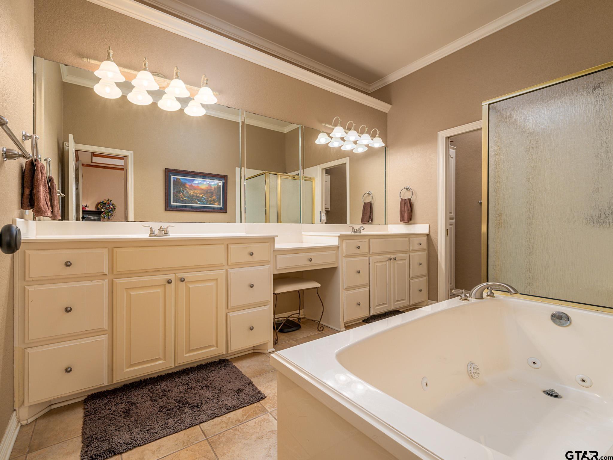 11201 Skyline Drive Brownsboro, TX 75756 - Photo 32 of 39 a spacious bathroom with a tub sink and a mirror