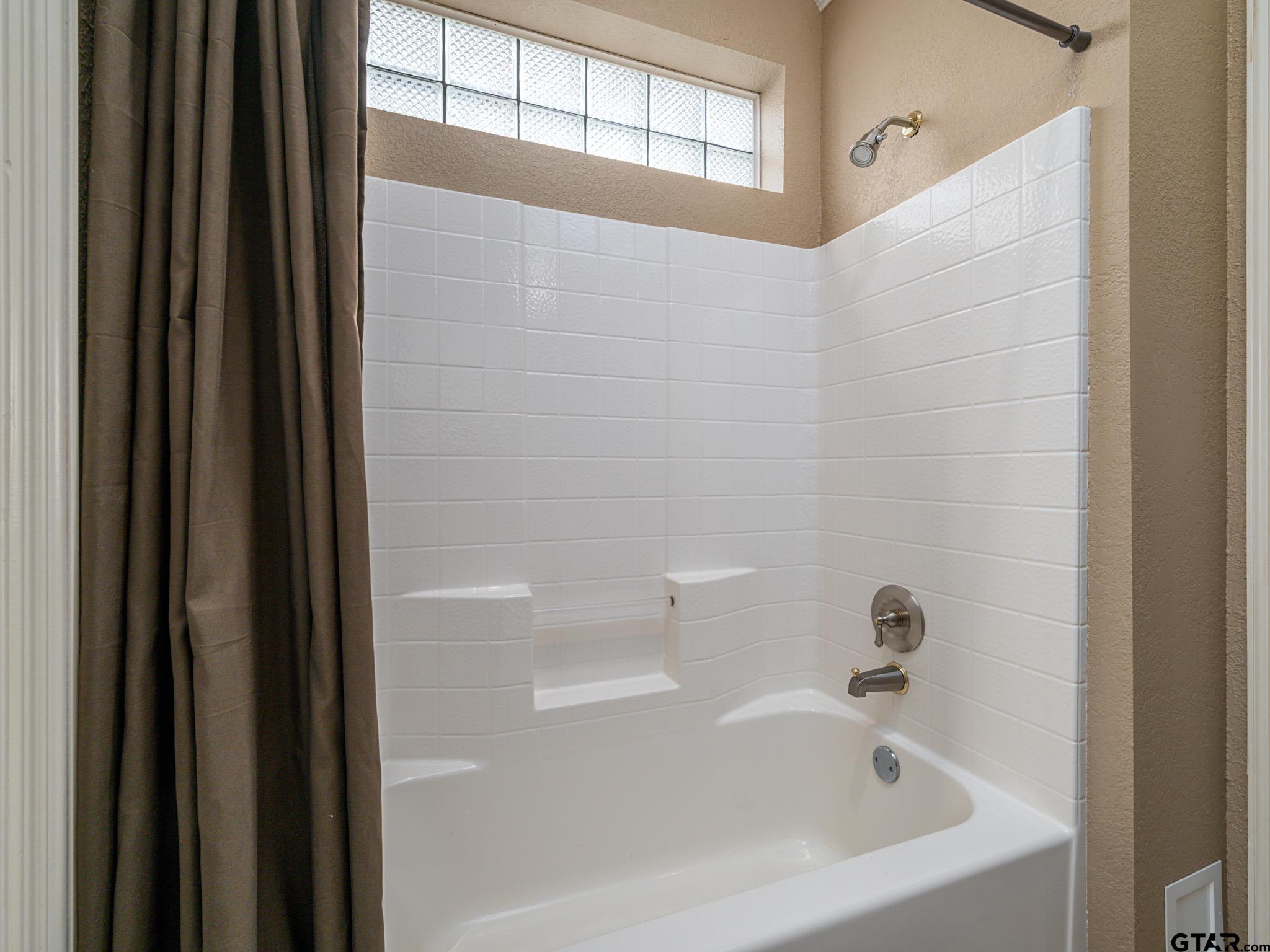 11201 Skyline Drive Brownsboro, TX 75756 - Photo 36 of 39 a bathroom with a bathtub