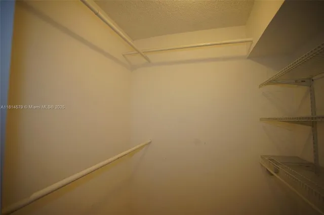 a view of a room with racks on the wall