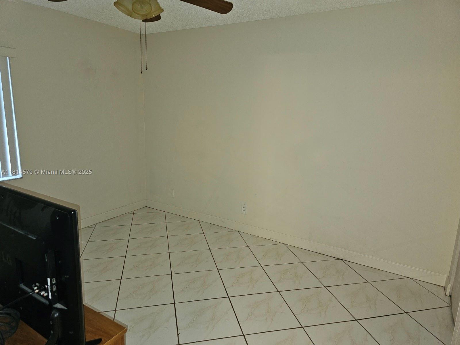 8380 Sands Point Boulevard, Unit J110 Tamarac, FL 33321 - Photo 16 of 34 a view of an empty room