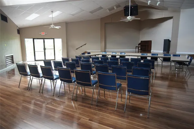 a kitchen with a table and chairs in it