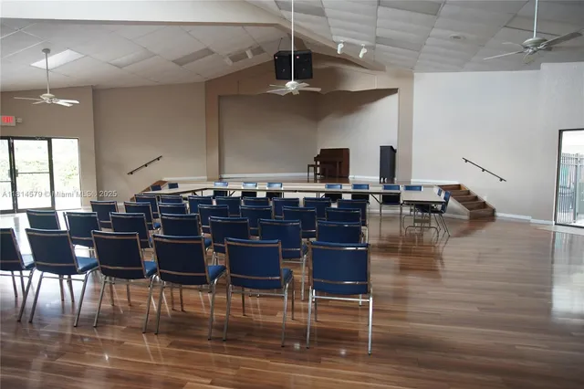 a view of a patio with a table and chairs