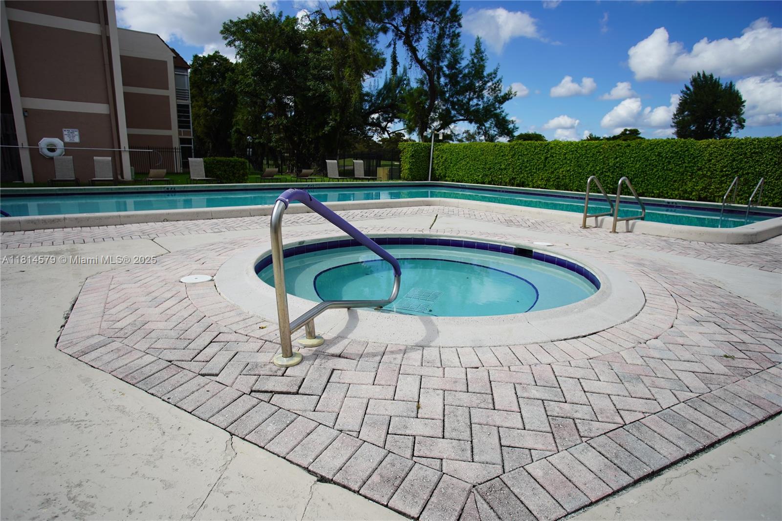 8380 Sands Point Boulevard, Unit J110 Tamarac, FL 33321 - Photo 27 of 34 a view of outdoor space with swimming pool