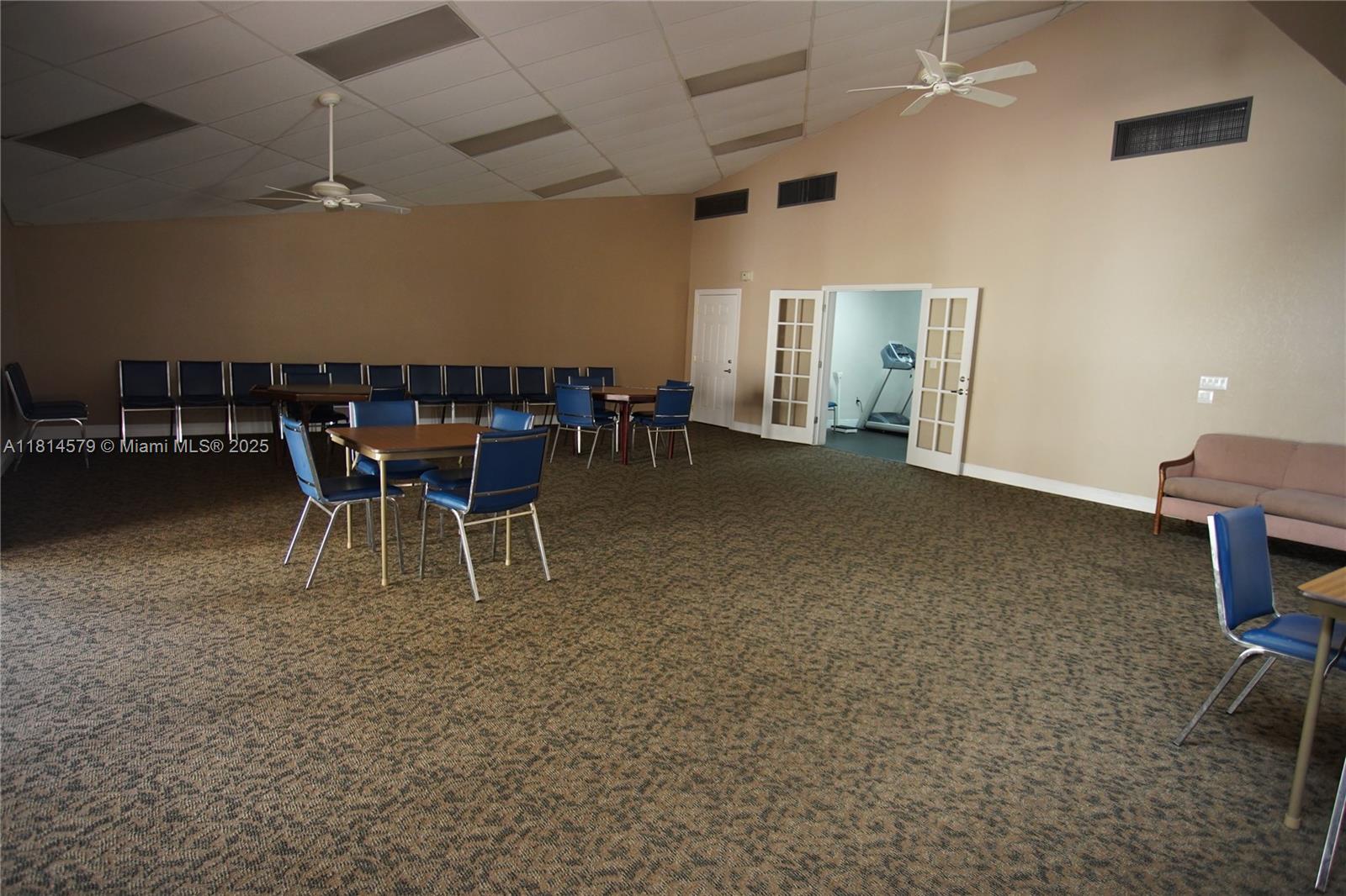8380 Sands Point Boulevard, Unit J110 Tamarac, FL 33321 - Photo 29 of 34 a view of a livingroom with furniture and a table