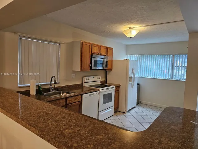 a bedroom with furniture and a chandelier
