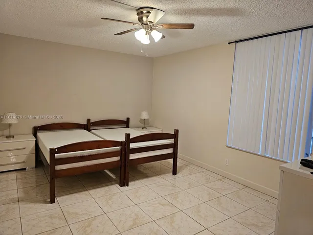 a view of walk in closet with a flat screen tv
