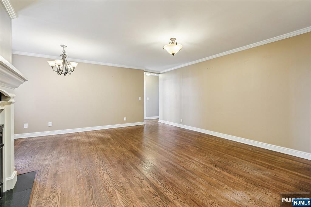 109 Grand Avenue, Unit 4A Englewood, NJ 07631 - Photo 11 of 39 wooden floor in an empty room with a window