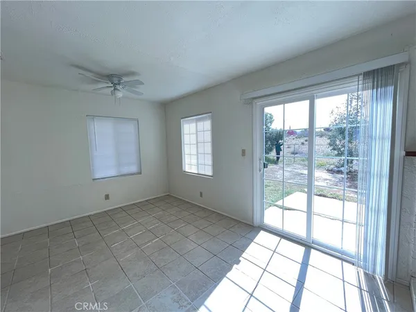 a view of an empty room and window