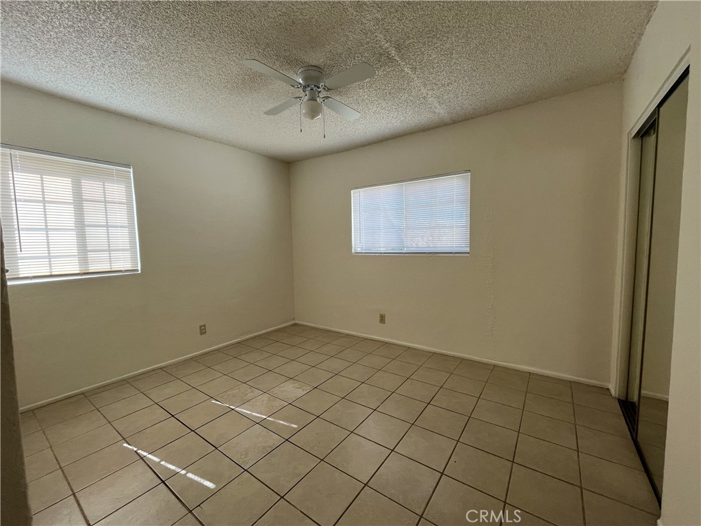 12014 Oasis Road Pinon Hills, CA 92372 - Photo 10 of 16 a view of an empty room and window