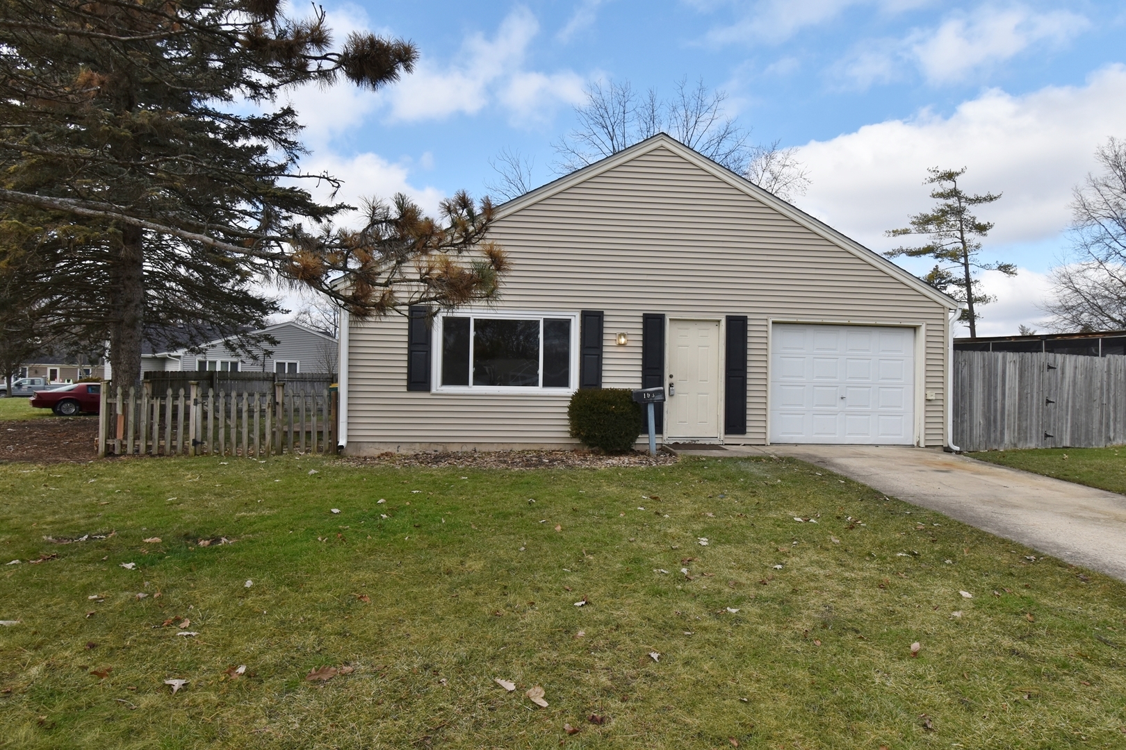 103 Tealwood Road Montgomery, IL 60538 - Photo 1 of 23 a front view of a house with a yard and garage