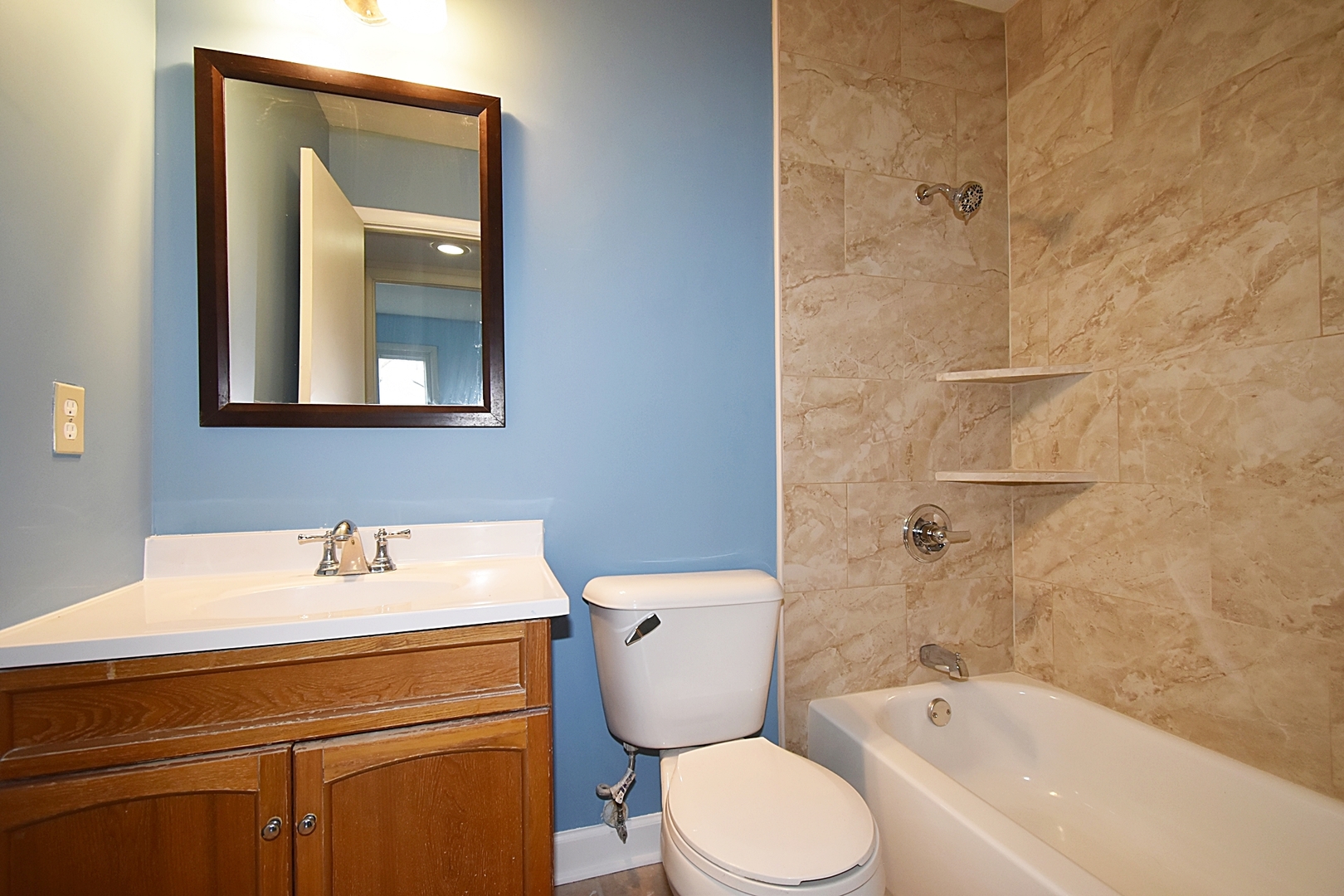 103 Tealwood Road Montgomery, IL 60538 - Photo 11 of 23 a bathroom with a sink toilet and shower