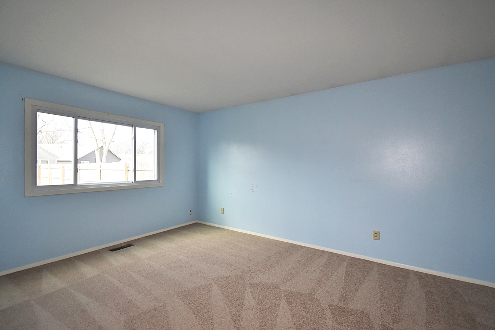 103 Tealwood Road Montgomery, IL 60538 - Photo 12 of 23 an empty room with a window