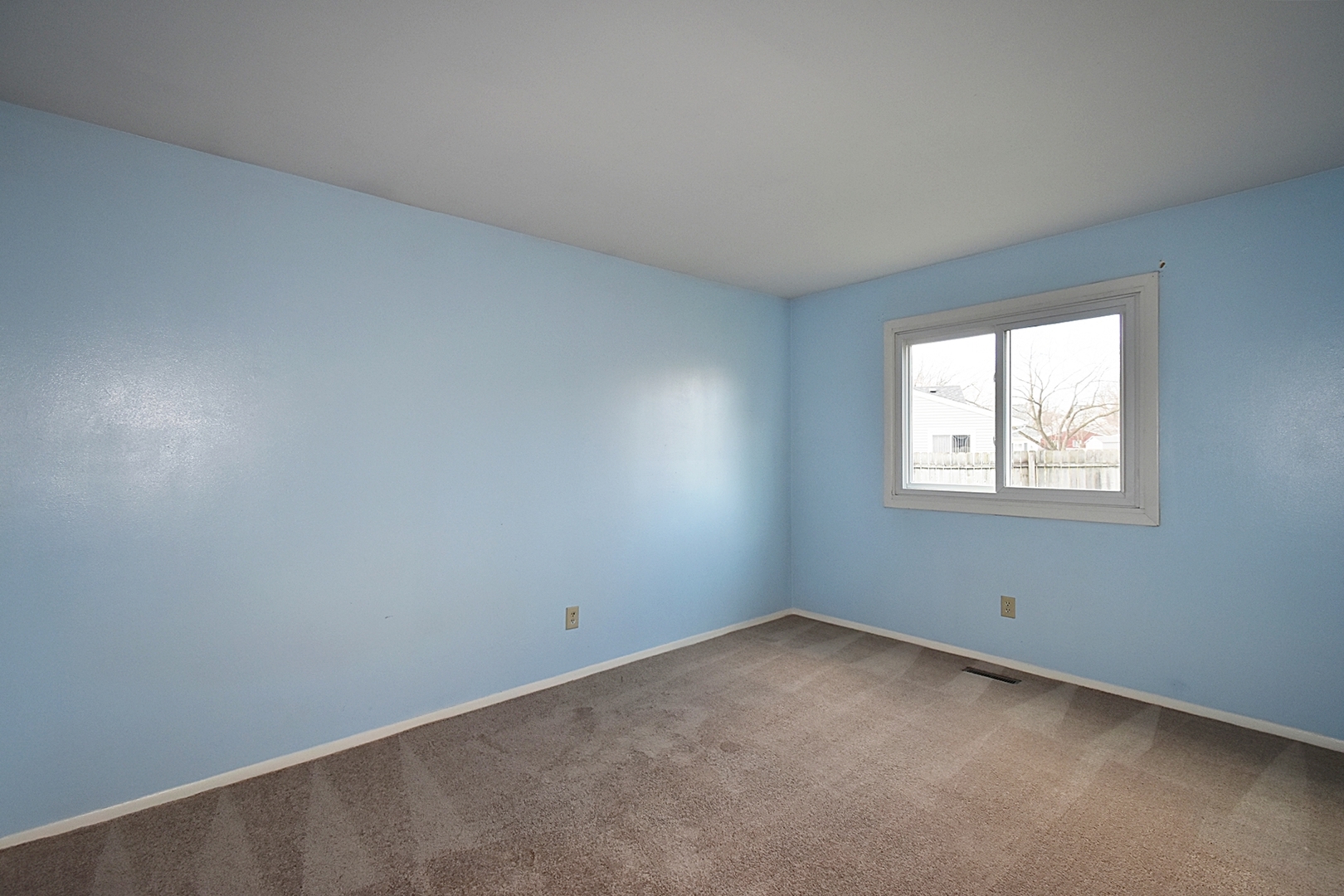 103 Tealwood Road Montgomery, IL 60538 - Photo 16 of 23 an empty room with a window