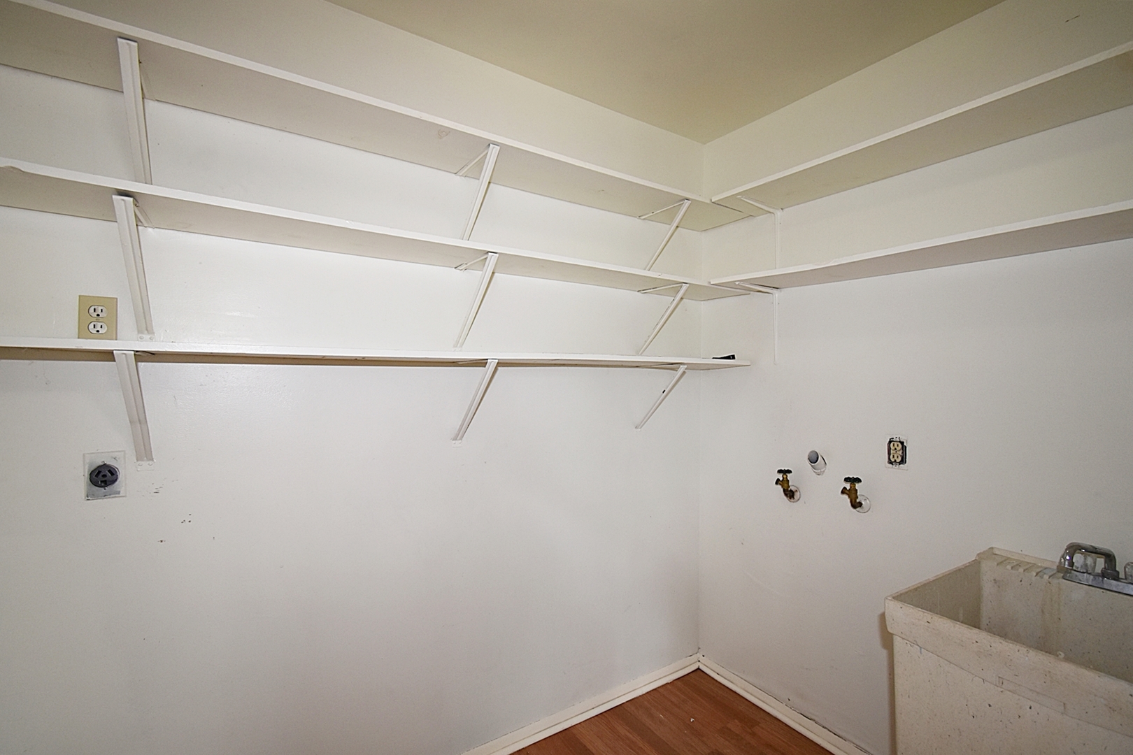 103 Tealwood Road Montgomery, IL 60538 - Photo 18 of 23 a view of a room with racks on the wall