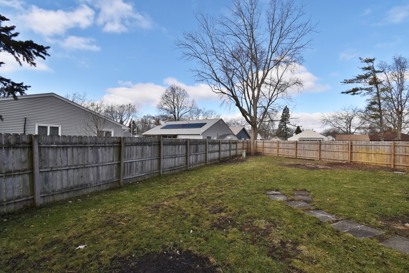 103 Tealwood Road Montgomery, IL 60538 - Photo 20 of 23 a view of a backyard with large trees