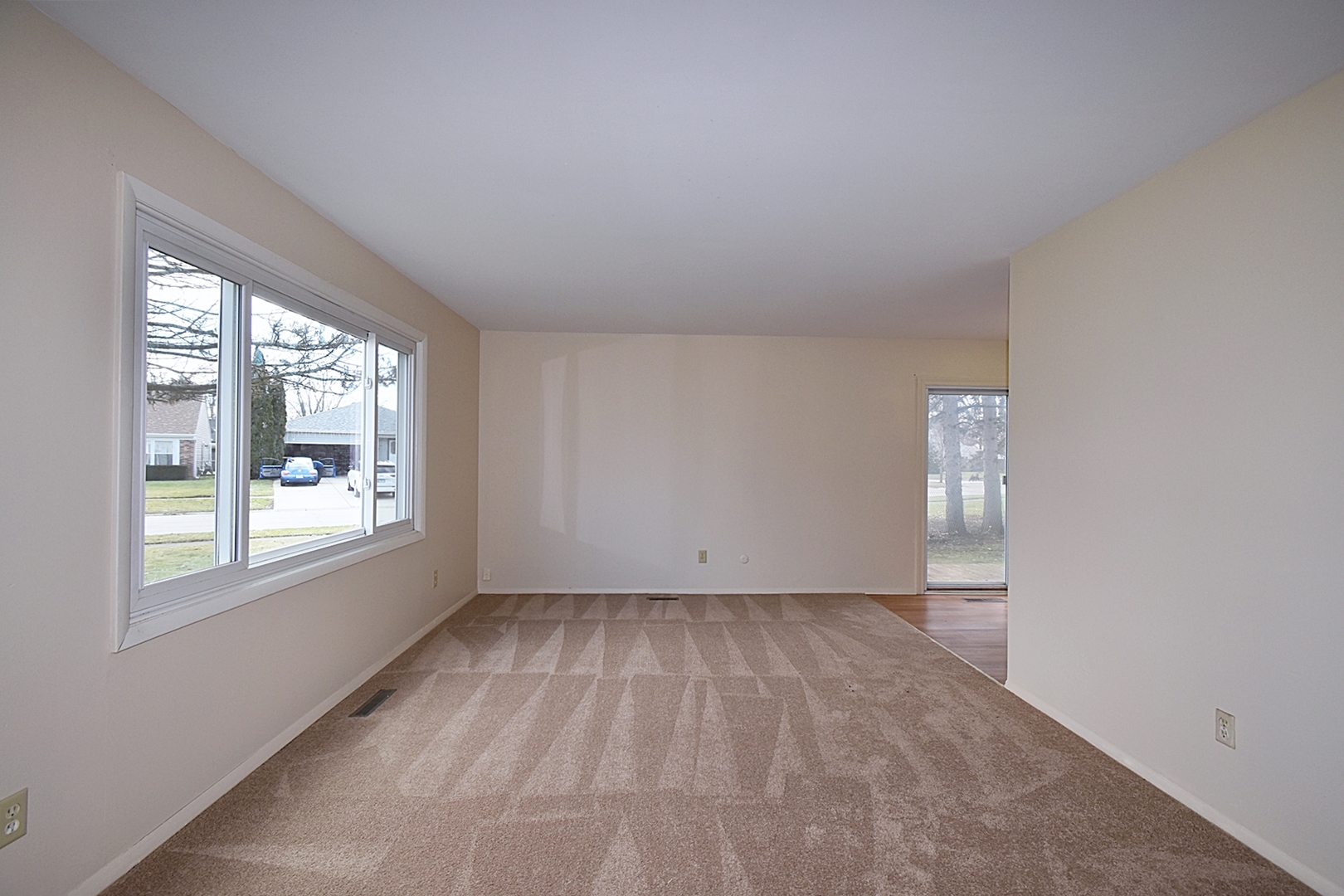 103 Tealwood Road Montgomery, IL 60538 - Photo 3 of 23 an empty room with windows