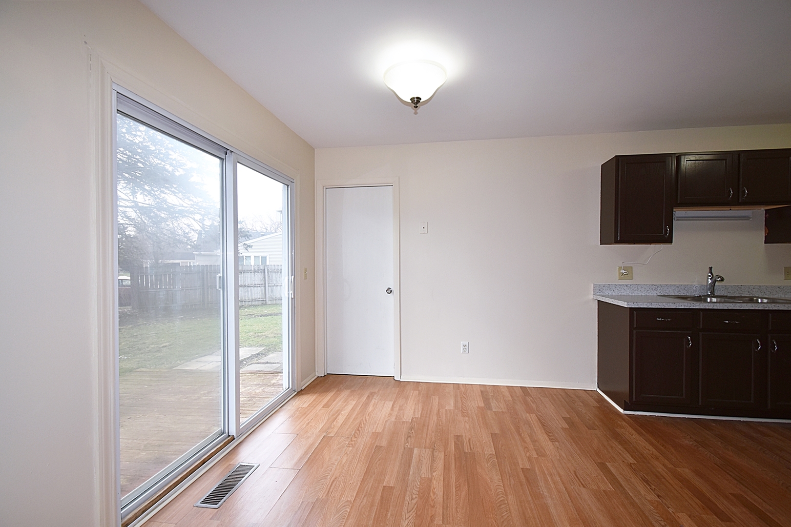 103 Tealwood Road Montgomery, IL 60538 - Photo 7 of 23 a view of kitchen with granite countertop window and a sink