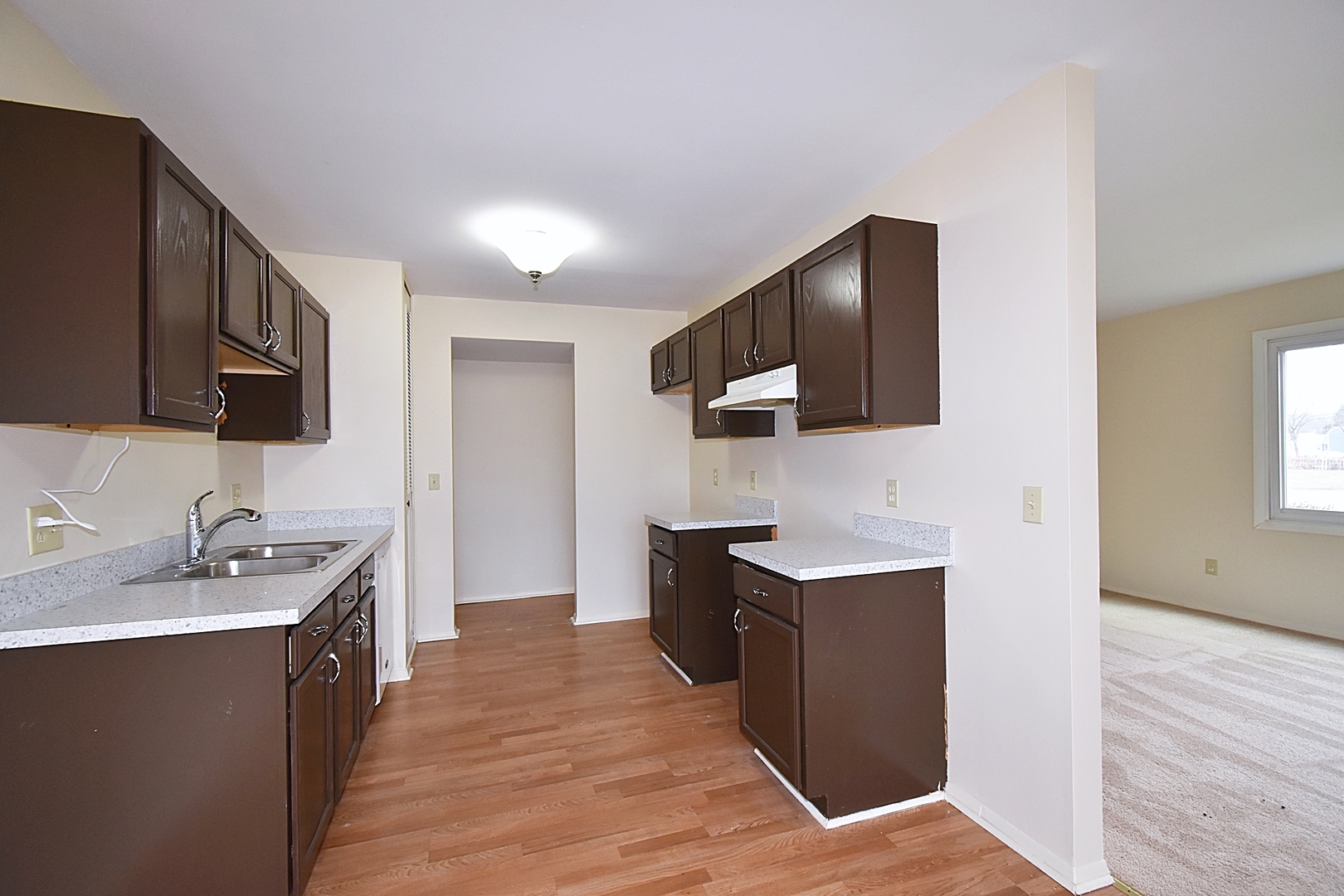 103 Tealwood Road Montgomery, IL 60538 - Photo 8 of 23 a kitchen with a sink stove top oven and refrigerator