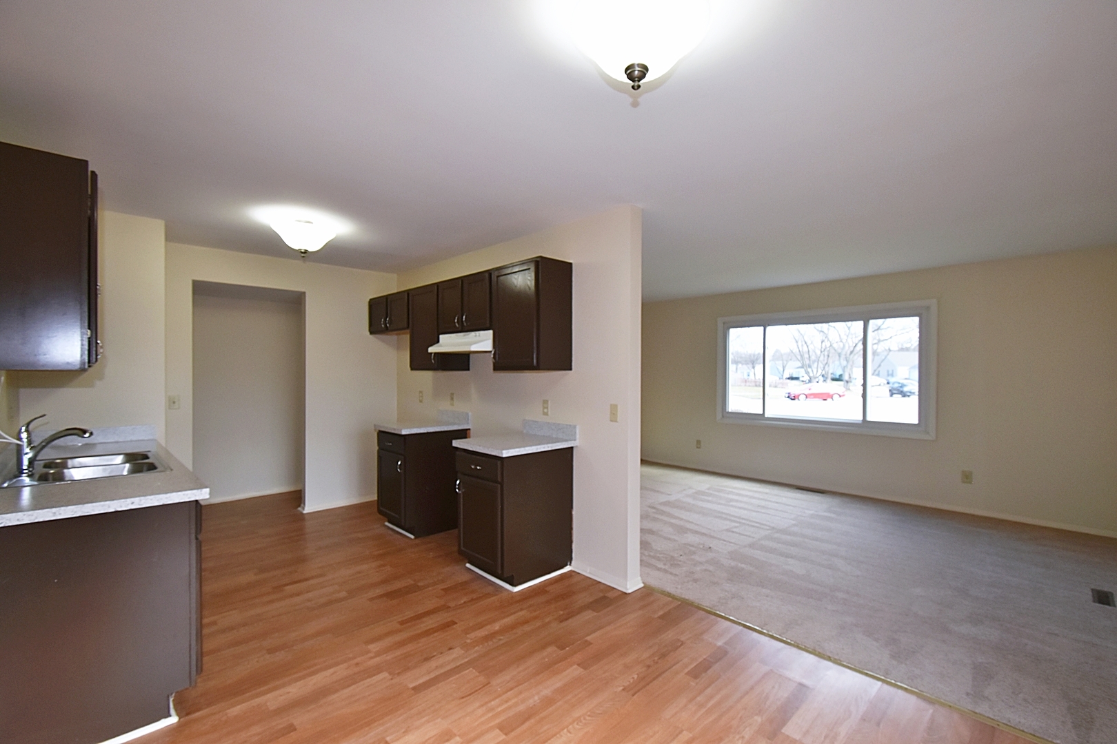 103 Tealwood Road Montgomery, IL 60538 - Photo 10 of 23 a view of kitchen with sink microwave and refrigerator