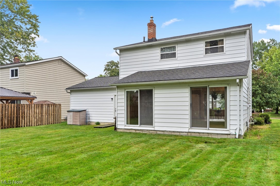 5624 Dolphin Road Mentor, OH 44060 - Photo 5 of 30 Rear view of house with a lawn