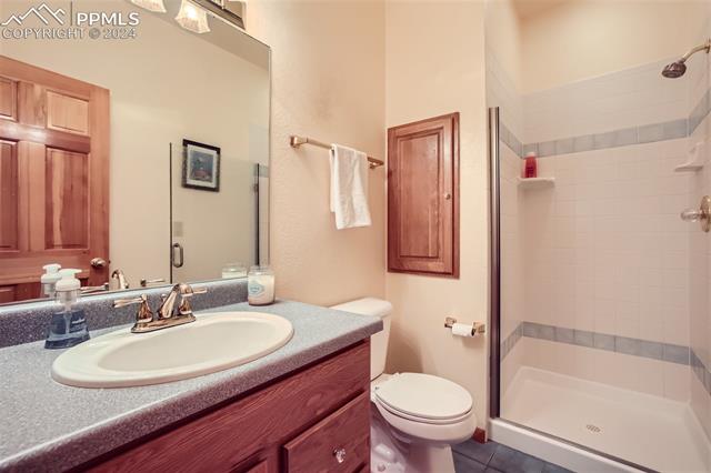 3715 Range View Road Monument, CO 80132 - Photo 22 of 49 Bathroom on main floor with a walk-in shower.