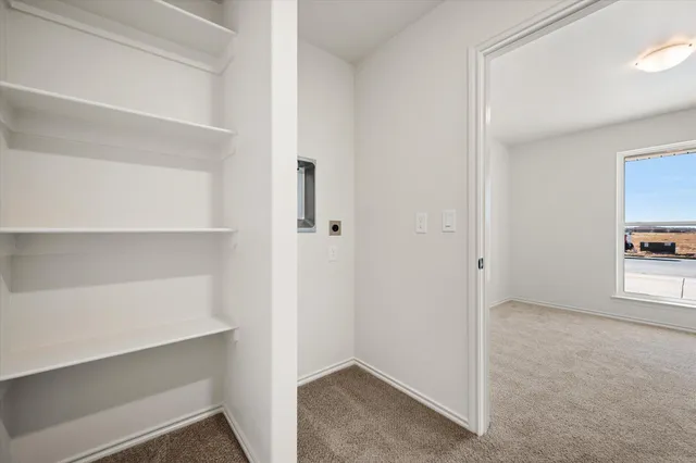 a view of an empty walk in closet
