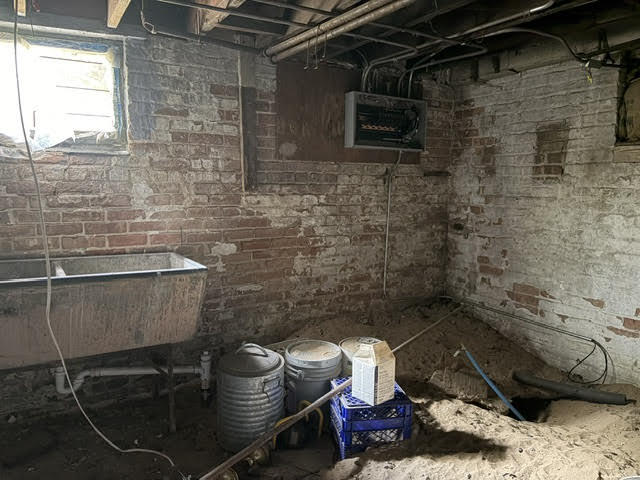 304 Polk Street Gary, IN 46402 - Photo 24 of 26 a bathroom with a toilet and a shower