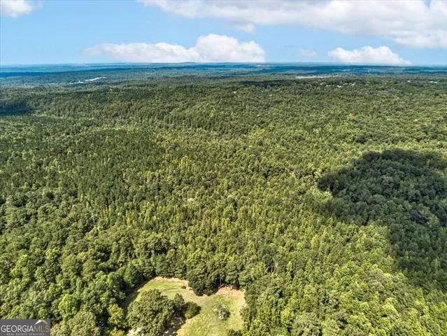 a view of a field with an outdoor space