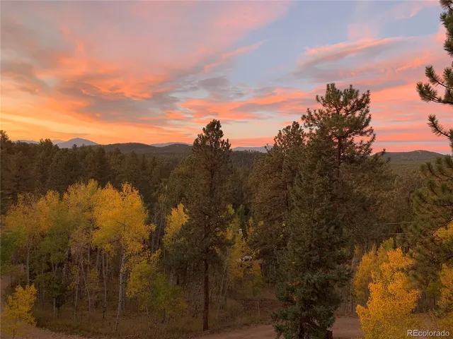 a view of mountain view with lots of trees