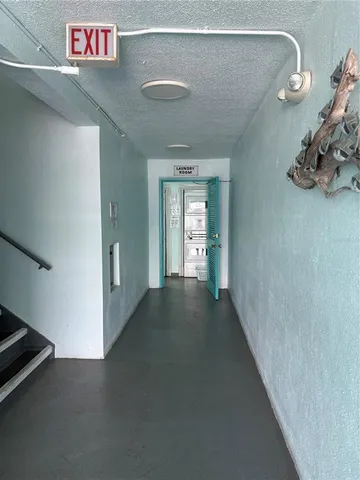 a view of a hallway with windows