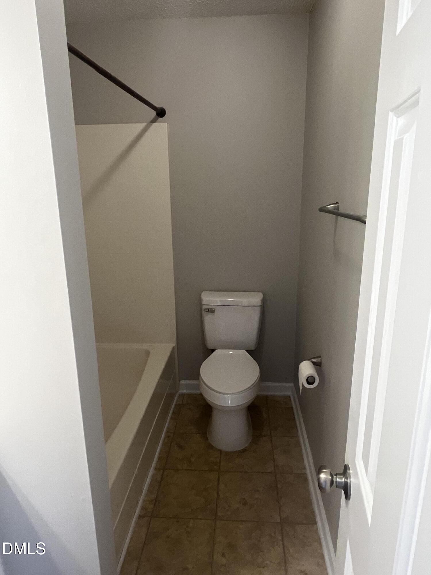5500 Marthonna Way Raleigh, NC 27616 - Photo 7 of 19 a bathroom with a toilet and a shower